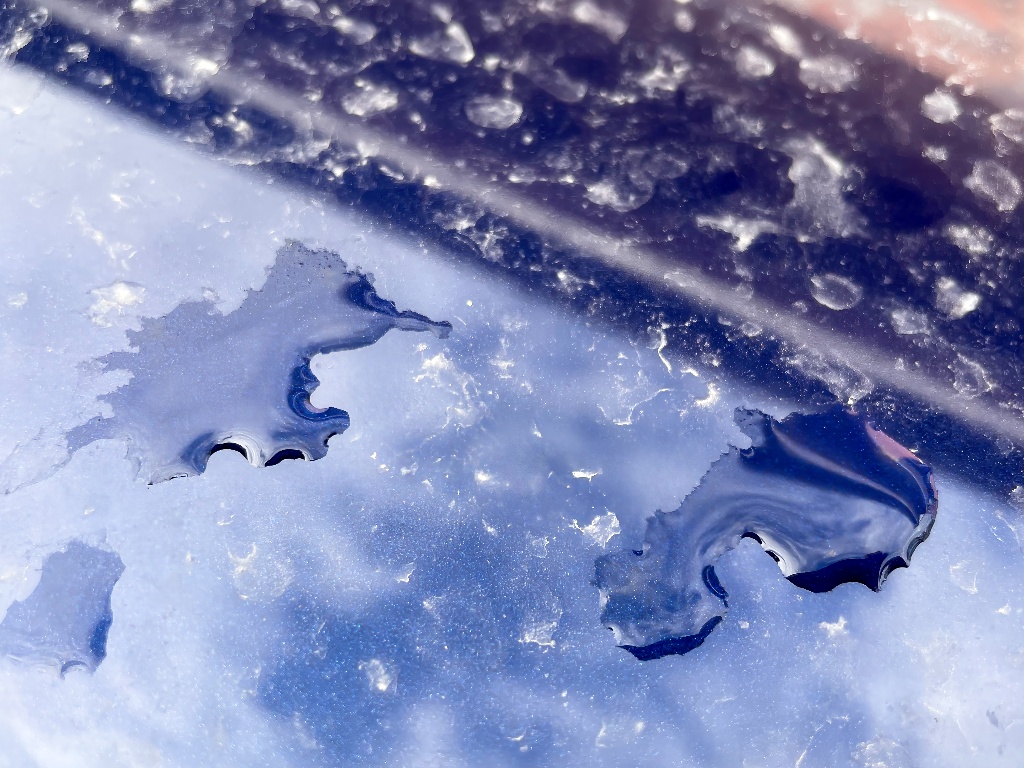 dusty drops on a blue car beneath a blue sky (resized image)