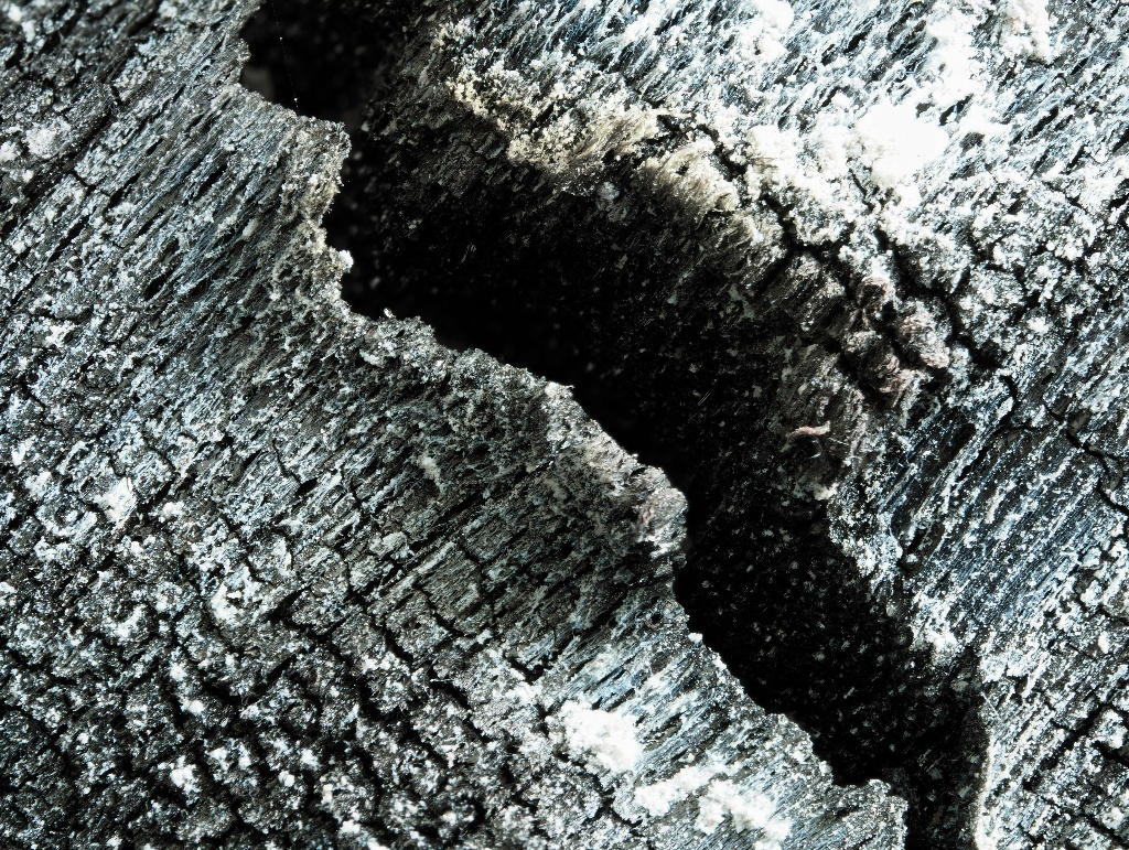 scorched piece of wood (diagonal corresponds to 2cm)  